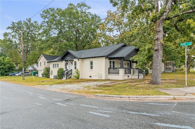 view of front of house with a front lawn and covered porch