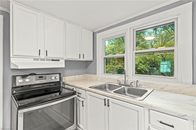 kitchen featuring ornamental molding, white cabinets, stainless steel electric stove, and sink