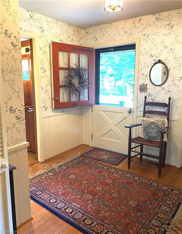 1229 Woodbrook Dr, Kernersville, NC 27284 - entrance foyer with light wood-style flooring and wallpapered walls