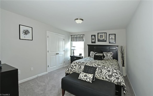 bedroom with light colored carpet