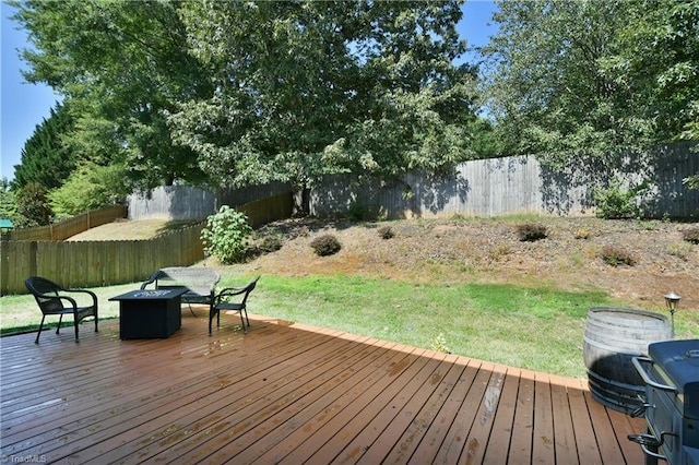 wooden terrace with a lawn