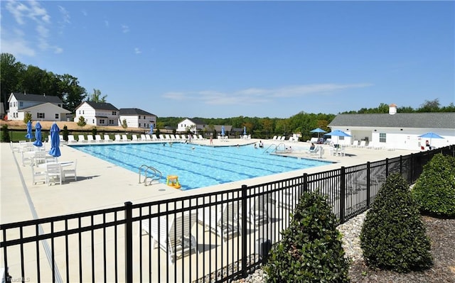 view of swimming pool with a patio