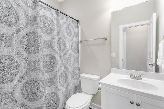 full bath with a shower with shower curtain, toilet, and vanity