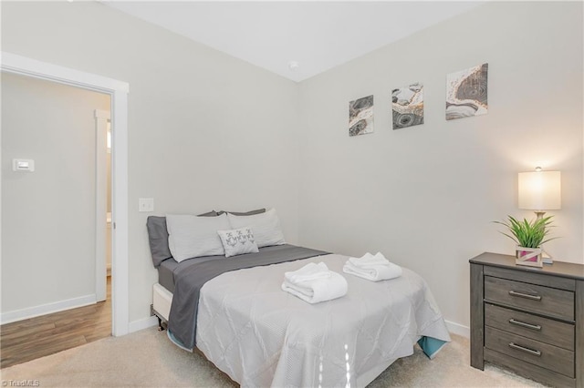 carpeted bedroom with baseboards