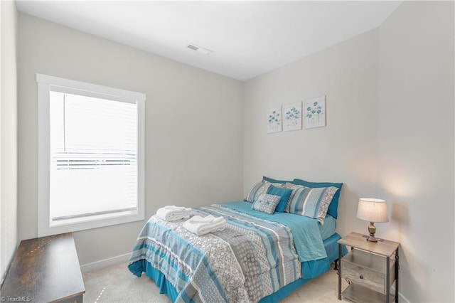 bedroom featuring visible vents, baseboards, and carpet flooring