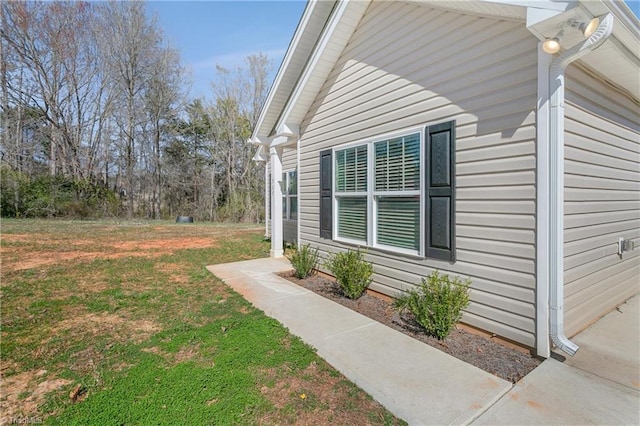 view of home's exterior featuring a yard