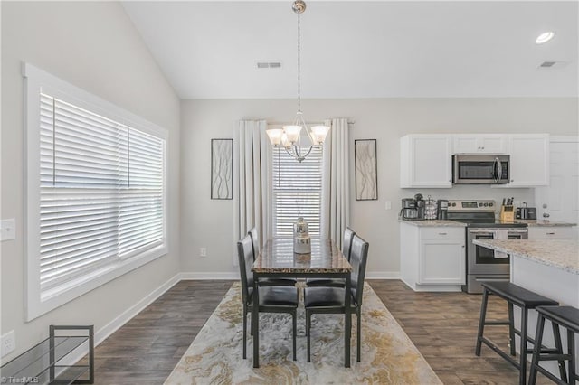 dining space with visible vents, baseboards, dark wood finished floors, vaulted ceiling, and an inviting chandelier