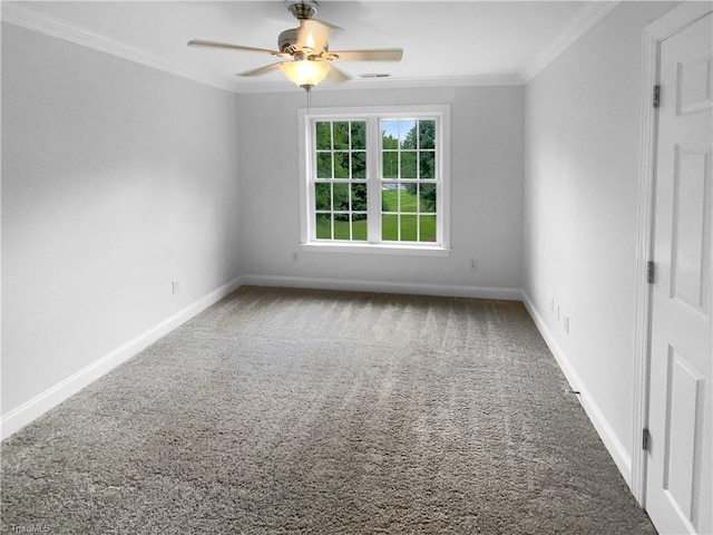 empty room featuring carpet floors, crown molding, ceiling fan, and baseboards