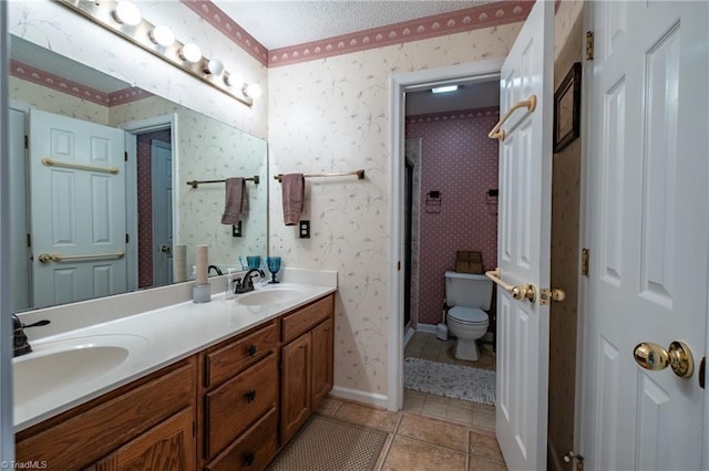 full bathroom with a stall shower, toilet, tile patterned flooring, and a sink