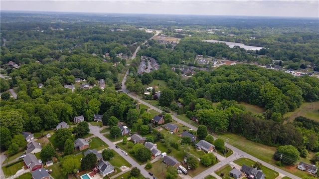 birds eye view of property with a wooded view