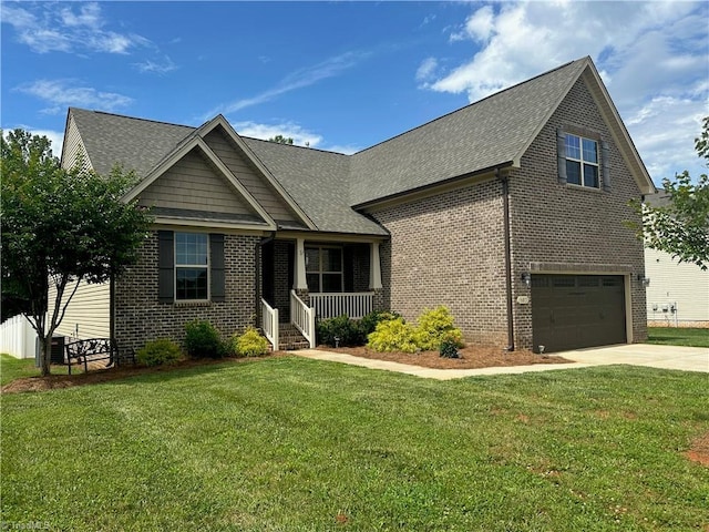 107 Saddlebrook Dr, Advance, NC 27006 - view of front of home featuring brick siding, a porch, driveway, and a front yard
