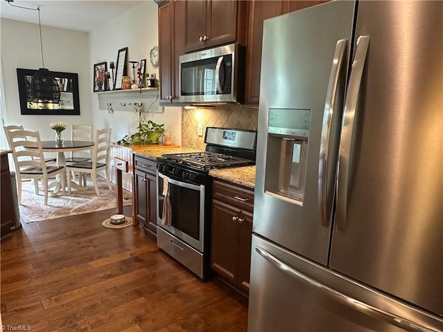 107 Saddlebrook Dr, Advance, NC 27006 - kitchen featuring appliances with stainless steel finishes, dark wood-style floors, decorative backsplash, light stone countertops, and dark brown cabinetry