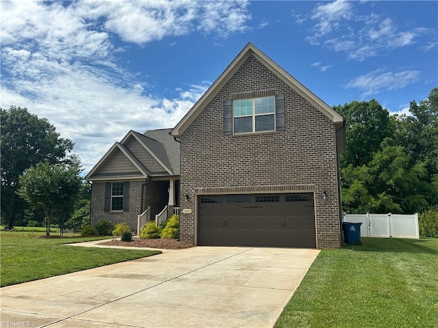 107 Saddlebrook Dr, Advance, NC 27006 - view of front facade with brick siding, an attached garage, and driveway