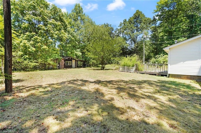 view of yard with a deck