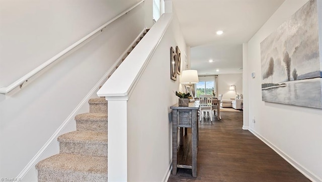 stairway featuring hardwood / wood-style flooring