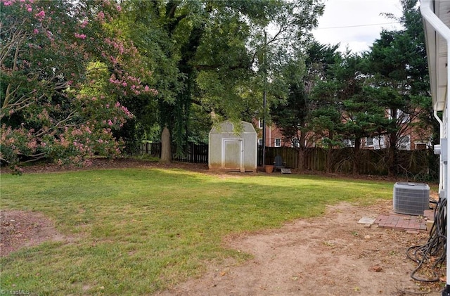 view of yard with a shed and central air condition unit