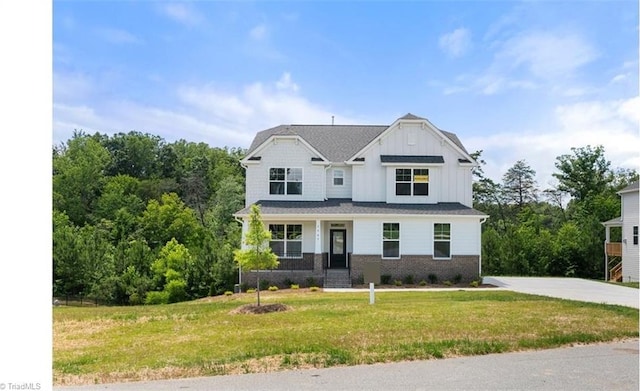 view of front of home featuring a front lawn and a porch