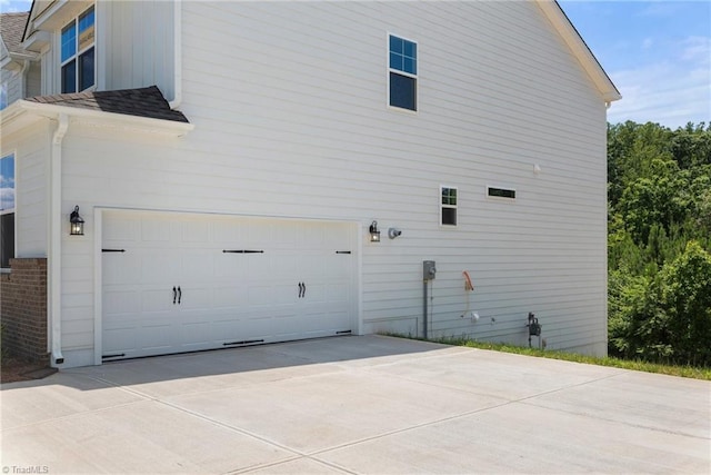 view of property exterior with a garage