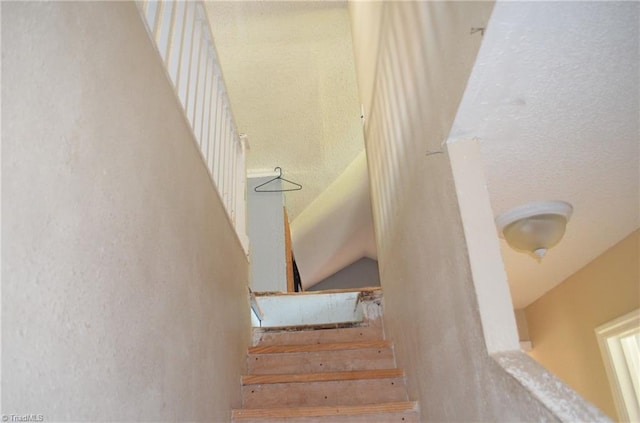 2706 W English Rd, High Point, NC 27262 - stairway featuring a textured wall