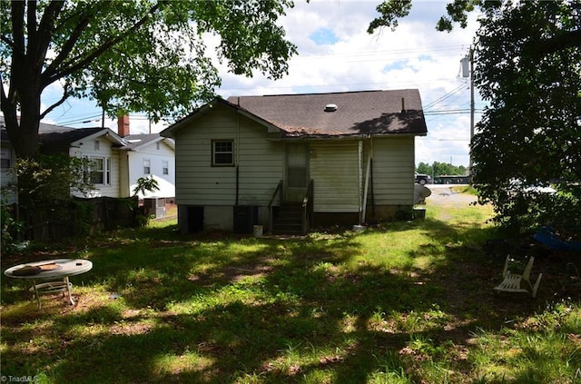 2706 W English Rd, High Point, NC 27262 - back of property featuring entry steps, a yard, and roof with shingles
