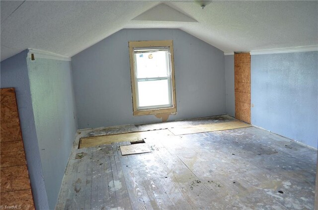 2706 W English Rd, High Point, NC 27262 - bonus room with vaulted ceiling and a textured ceiling