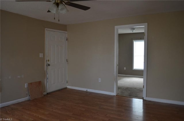 2706 W English Rd, High Point, NC 27262 - empty room with a ceiling fan, wood finished floors, and baseboards
