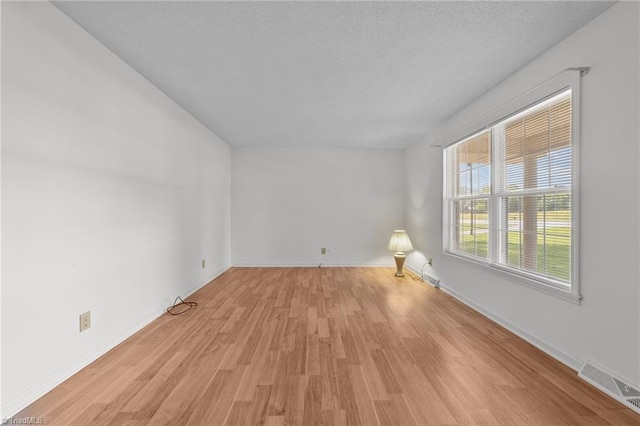 3785 Ellisboro Rd, Stokesdale, NC 27357 - spare room with light wood-type flooring and baseboards