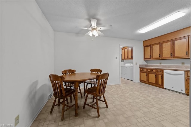 3785 Ellisboro Rd, Stokesdale, NC 27357 - dining space with washing machine and clothes dryer, a ceiling fan, baseboards, and a textured ceiling