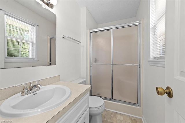 3785 Ellisboro Rd, Stokesdale, NC 27357 - bathroom featuring a shower with shower door, toilet, and vanity