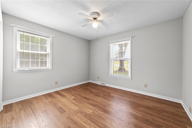 3785 Ellisboro Rd, Stokesdale, NC 27357 - empty room featuring a ceiling fan, wood finished floors, baseboards, and a textured ceiling