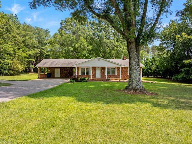 3785 Ellisboro Rd, Stokesdale, NC 27357 - ranch-style house with a chimney, concrete driveway, a carport, and a front yard