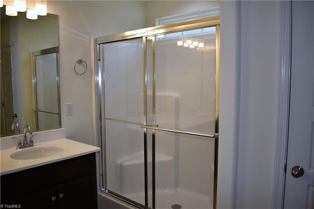 bathroom featuring a stall shower and vanity