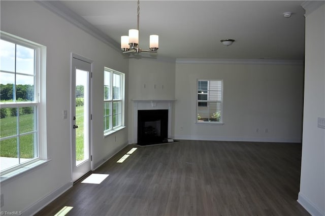 unfurnished living room featuring plenty of natural light, crown molding, and a fireplace with flush hearth