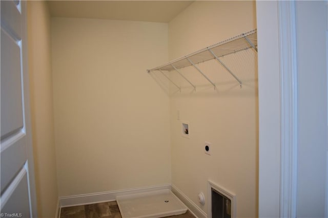 washroom with hookup for a washing machine, laundry area, hookup for an electric dryer, and baseboards