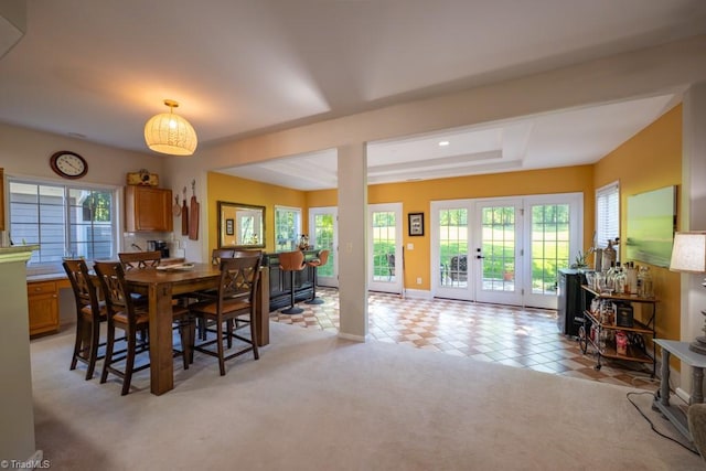 121 Walter Hagen Dr, Mebane, NC 27302 - dining space with a tray ceiling, baseboards, and a wood stove