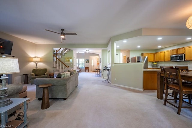 121 Walter Hagen Dr, Mebane, NC 27302 - living room featuring stairway, light colored carpet, recessed lighting, a ceiling fan, and baseboards