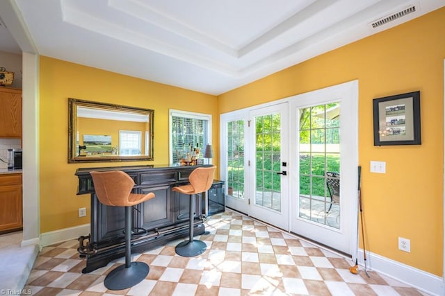 121 Walter Hagen Dr, Mebane, NC 27302 - indoor dry bar featuring baseboards, a tray ceiling, light floors, and decorative backsplash