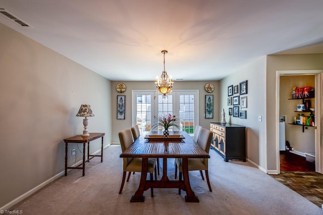 121 Walter Hagen Dr, Mebane, NC 27302 - dining space featuring carpet floors, baseboards, and a chandelier