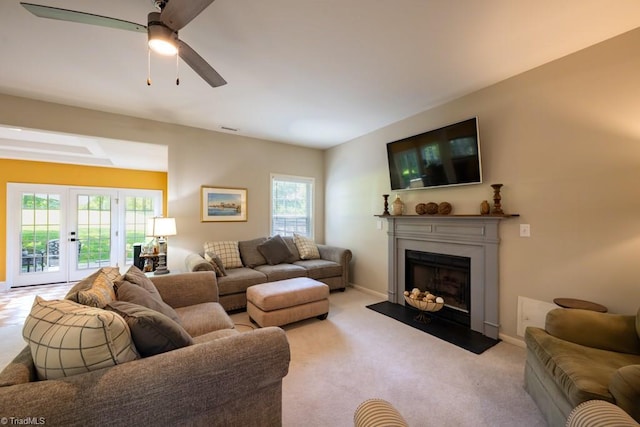 121 Walter Hagen Dr, Mebane, NC 27302 - living room with a fireplace with flush hearth, light colored carpet, a ceiling fan, and baseboards