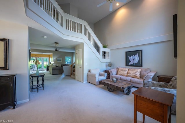 121 Walter Hagen Dr, Mebane, NC 27302 - living area featuring ceiling fan, carpet, stairway, a high ceiling, and baseboards