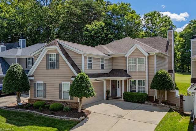 121 Walter Hagen Dr, Mebane, NC 27302 - view of front of property with driveway, an attached garage, roof with shingles, and a chimney