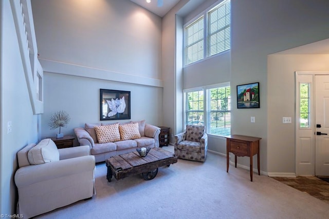 121 Walter Hagen Dr, Mebane, NC 27302 - living room with a towering ceiling, carpet flooring, and baseboards