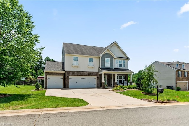 1720 Ridge Bluff Cir, Rural Hall, NC 27045 - craftsman-style house with concrete driveway, a front yard, brick siding, a garage, and a porch