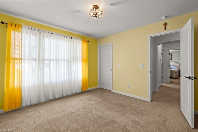 1720 Ridge Bluff Cir, Rural Hall, NC 27045 - unfurnished bedroom featuring carpet flooring and arched walkways