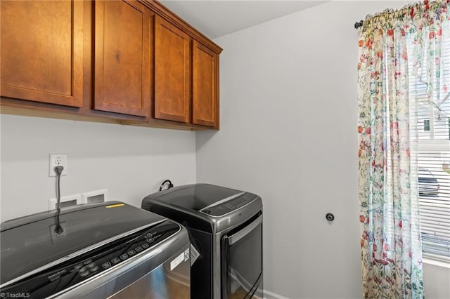 1720 Ridge Bluff Cir, Rural Hall, NC 27045 - laundry area featuring washing machine and dryer and cabinet space