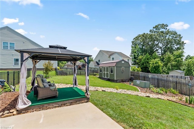 1720 Ridge Bluff Cir, Rural Hall, NC 27045 - fenced backyard featuring a storage unit, a gazebo, and a patio