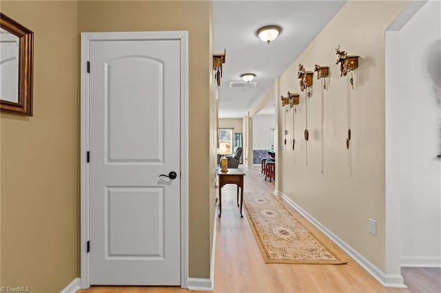 1720 Ridge Bluff Cir, Rural Hall, NC 27045 - hallway featuring light wood finished floors and baseboards