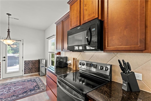 1720 Ridge Bluff Cir, Rural Hall, NC 27045 - kitchen featuring black microwave, stainless steel range with electric stovetop, wood finished floors, and dark stone countertops