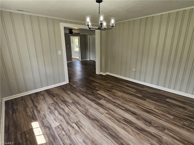 unfurnished dining area featuring dark wood-style floors, baseboards, visible vents, and a notable chandelier