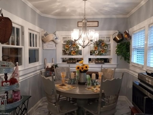 dining space featuring ornamental molding and a chandelier